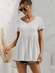 White V-neck tee with gathered waistline and short sleeves, casual babydoll style.
