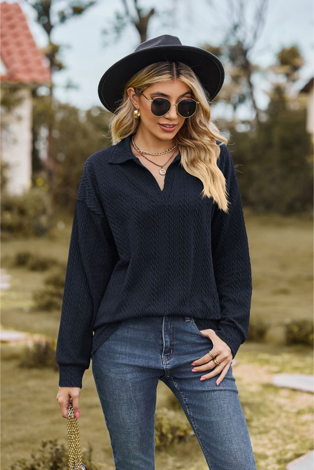 Dark Blue Textured Cable Knit Polo Top with a V-neck and long sleeves.