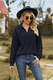 Dark Blue Textured Cable Knit Polo Top with a V-neck and long sleeves.