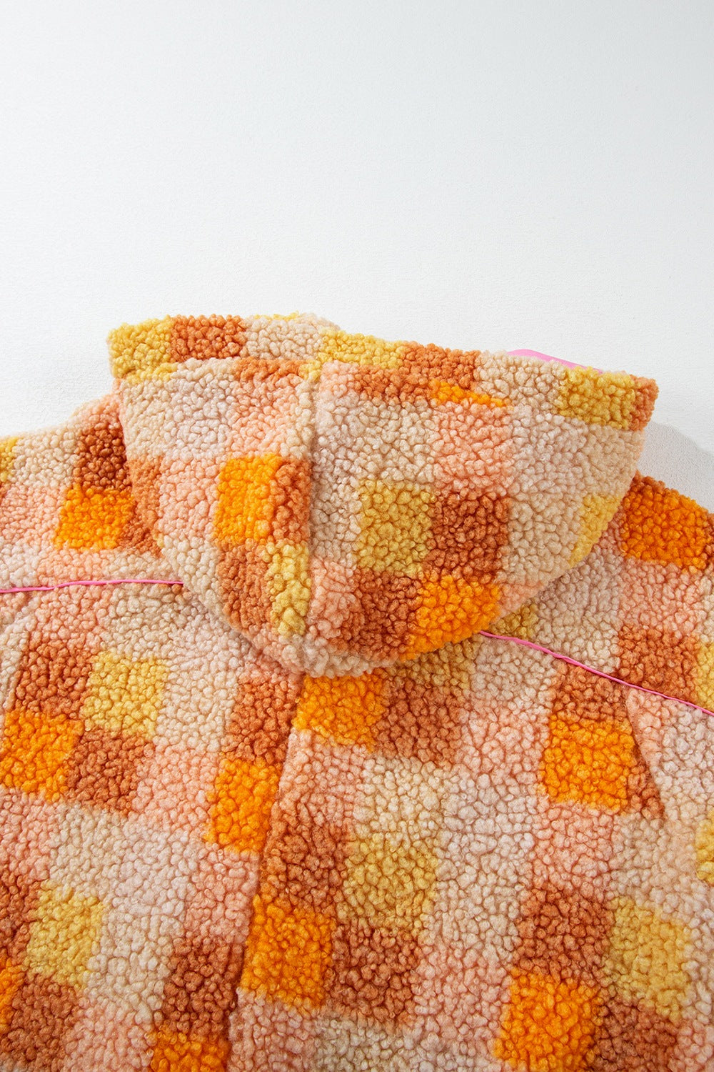 Checkerboard sherpa jacket in tangerine with contrast collar and hood detail