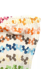 Vibrant floral ruching tank top with a textured knit and colorful daisy pattern.