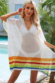 White crochet cover-up with rainbow hemline and V-neck.