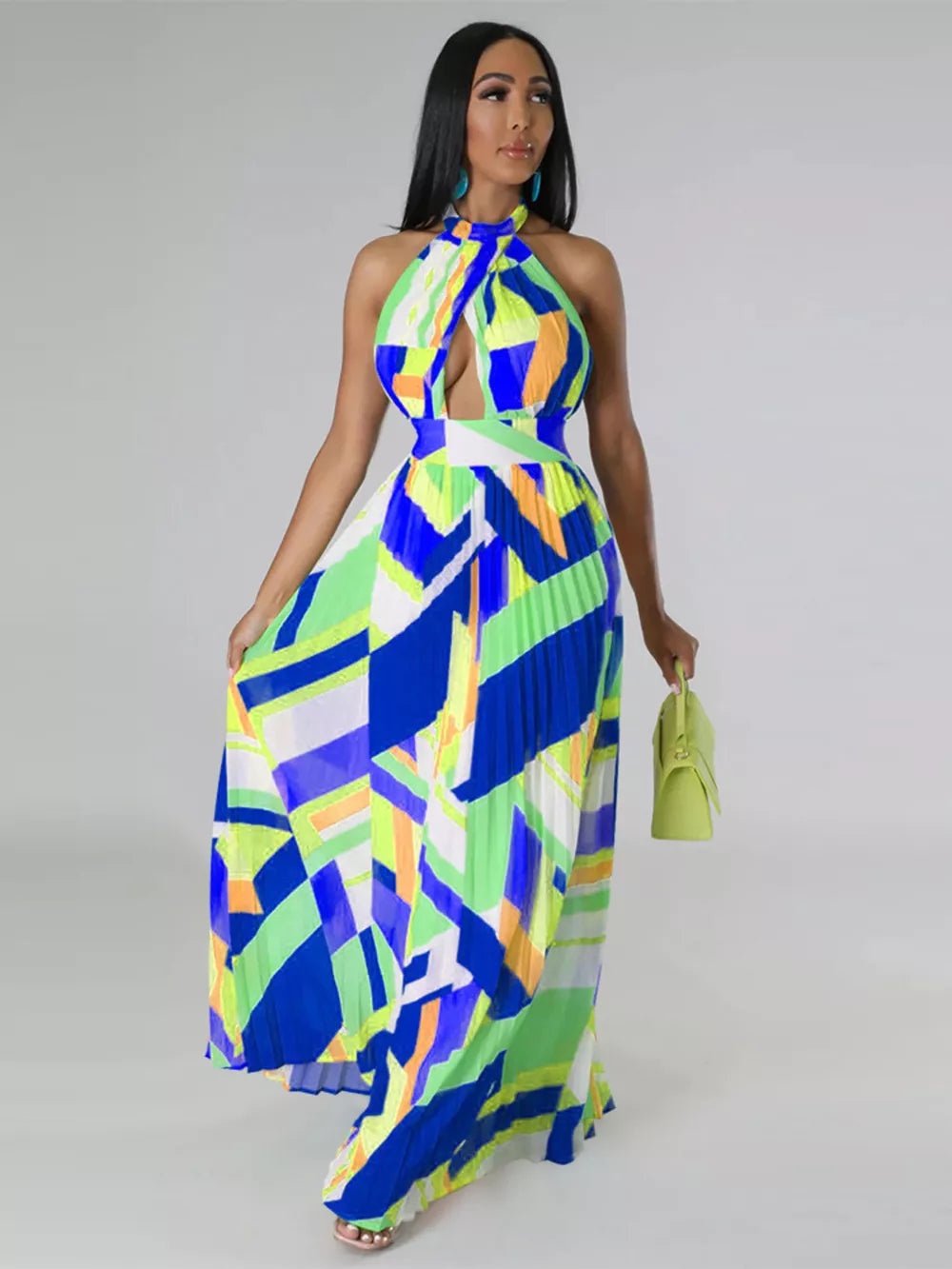 Halter neck maxi dress with bold geometric print, defined waistband, and pleated skirt.