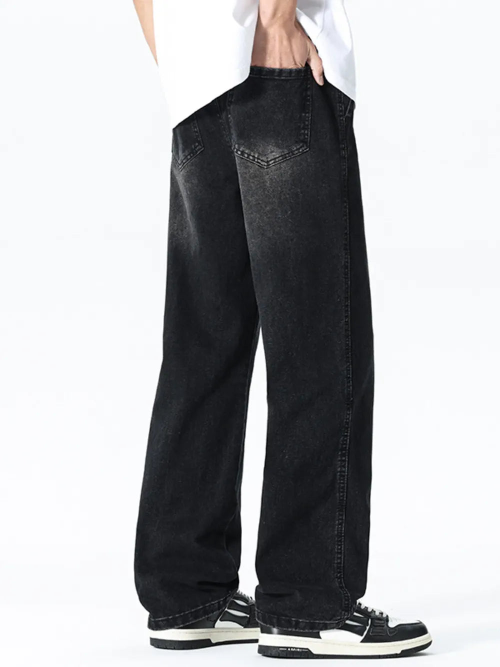 Relaxed wide leg black denim jeans with drawstring waist and visible back pockets.