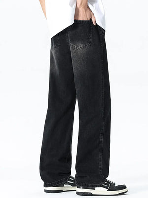 Relaxed wide leg black denim jeans with drawstring waist and visible back pockets.