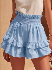 Sky blue ruffled high-waisted shorts with smocked waistband and tiered hem.
