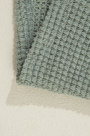 Sage waffle knit open-front duster cardigan with textured fabric detail.