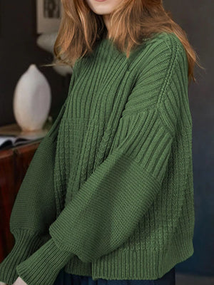Moss green textured knit round-neck pullover sweater with ribbed details and balloon sleeves.