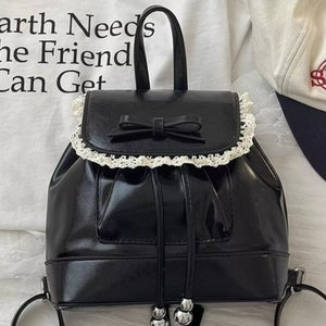Black patent mini backpack with lace trim and bowknot detail