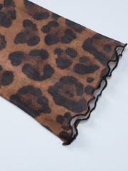 Sheer animal print mesh blouse with lettuce edge trim.