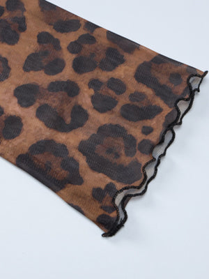 Sheer animal print mesh blouse with lettuce edge trim.