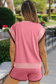 Colorblock loungewear set in dusty pink with pastel trim and brown piping on shorts.