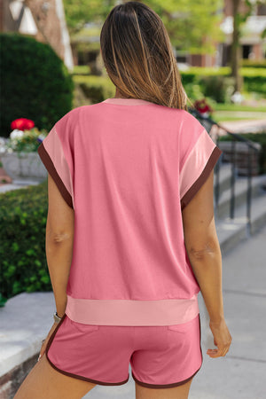 Colorblock loungewear set in dusty pink with pastel trim and brown piping on shorts.