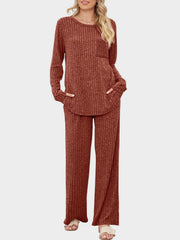 Ribbed knit lounge set in Terracotta with long sleeves, crew neck, chest pocket, and wide-leg pants.