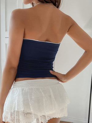 Navy bandeau top with white trim detail.
