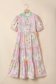 Pink floral tiered cotton dress with puff sleeves and ruffled collar.