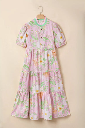 Pink floral tiered cotton dress with puff sleeves and ruffled collar.