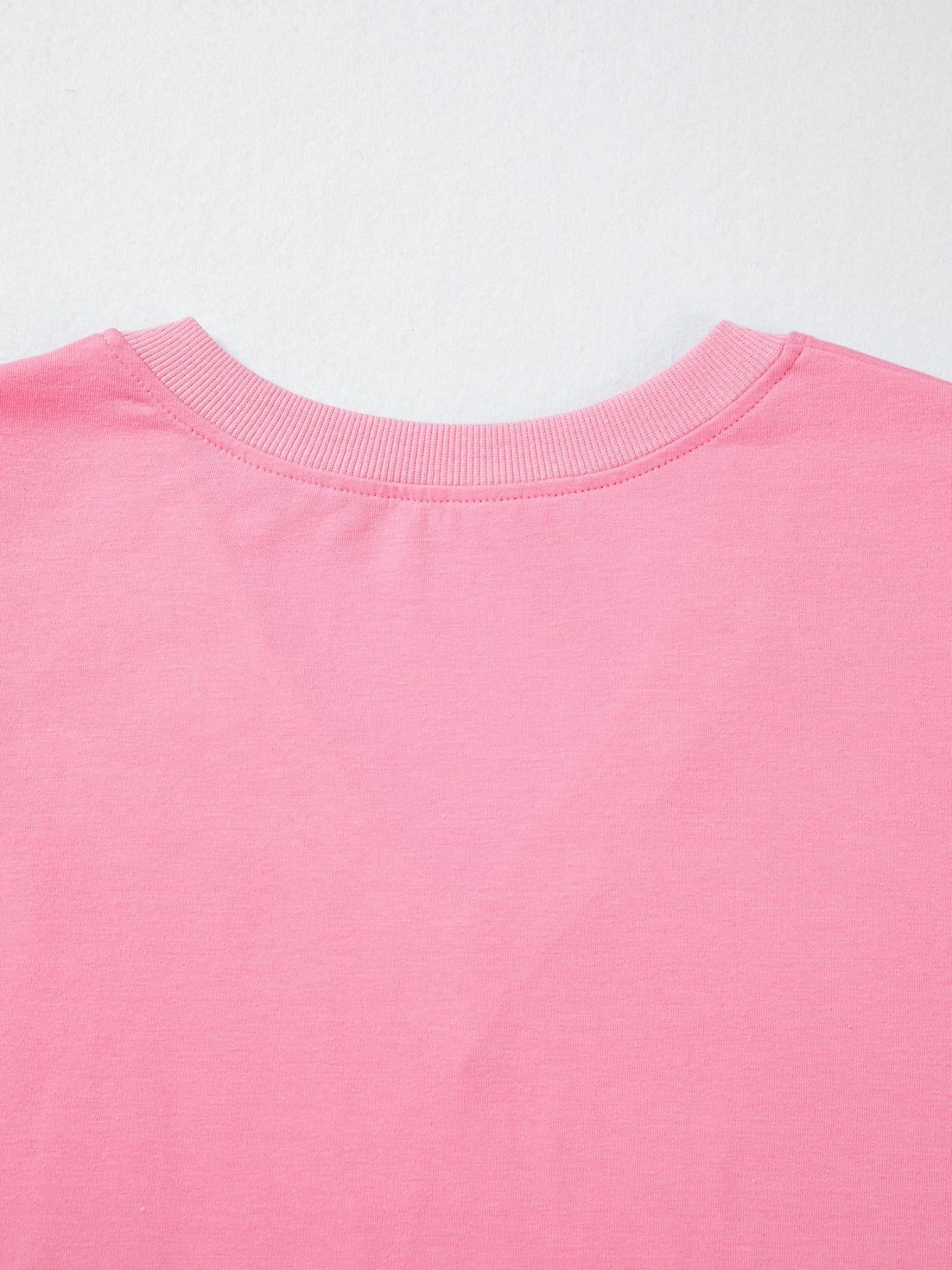 Pink cotton V-neck blouse with ribbed neckline detail