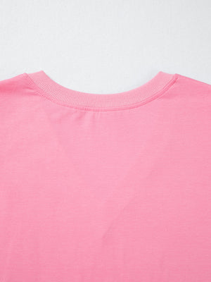 Pink cotton V-neck blouse with ribbed neckline detail
