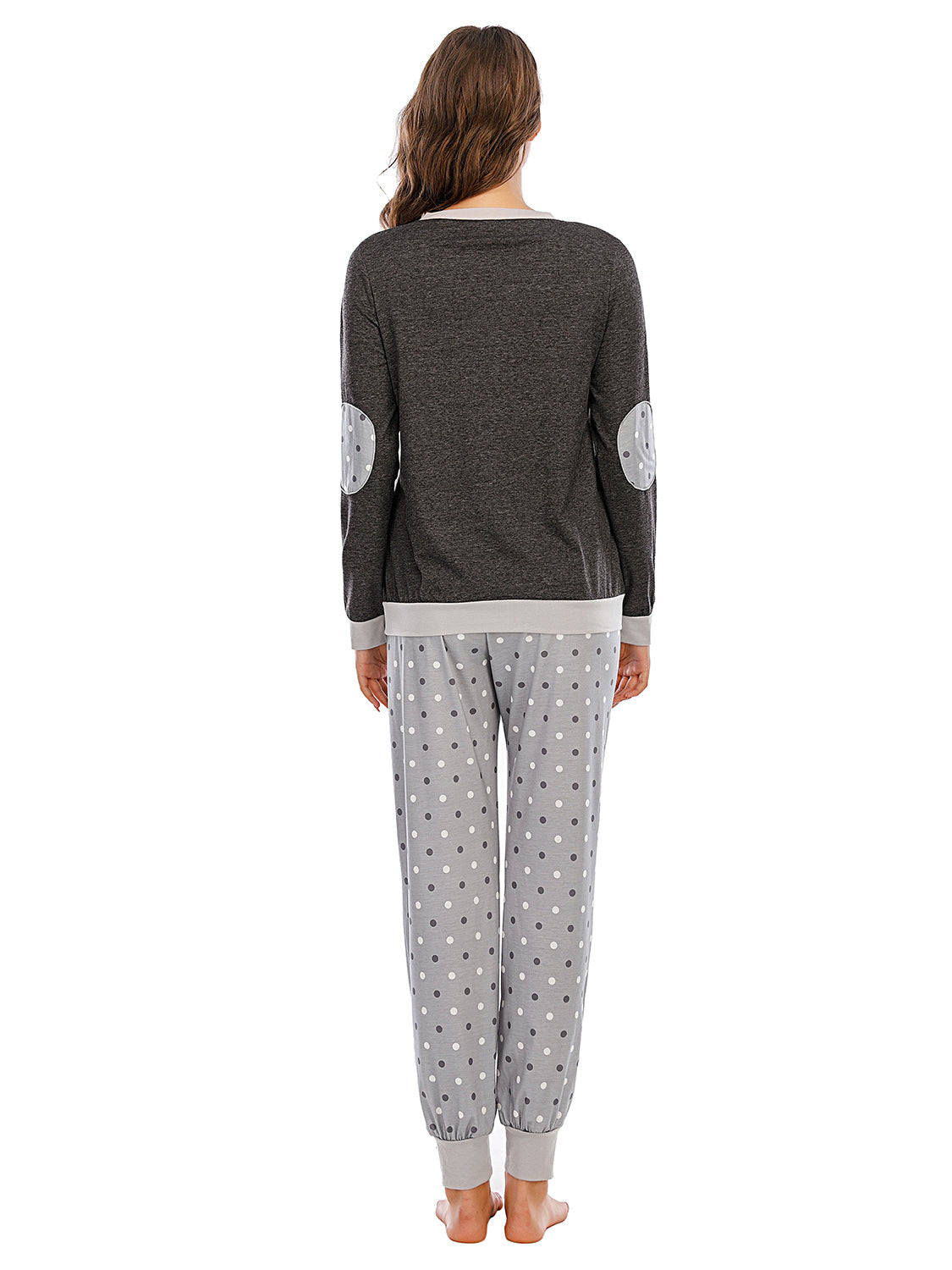 Dark grey loungewear set with polka dot elbow patches and matching polka dot pants.