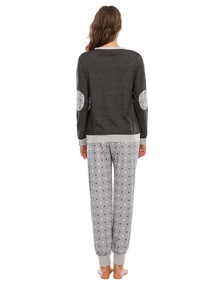 Dark grey loungewear set with polka dot elbow patches and matching polka dot pants.