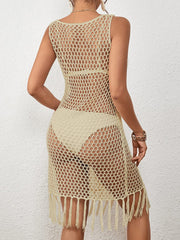 Open-knit beach cover-up dress in beige with fringe hem and sleeveless design.