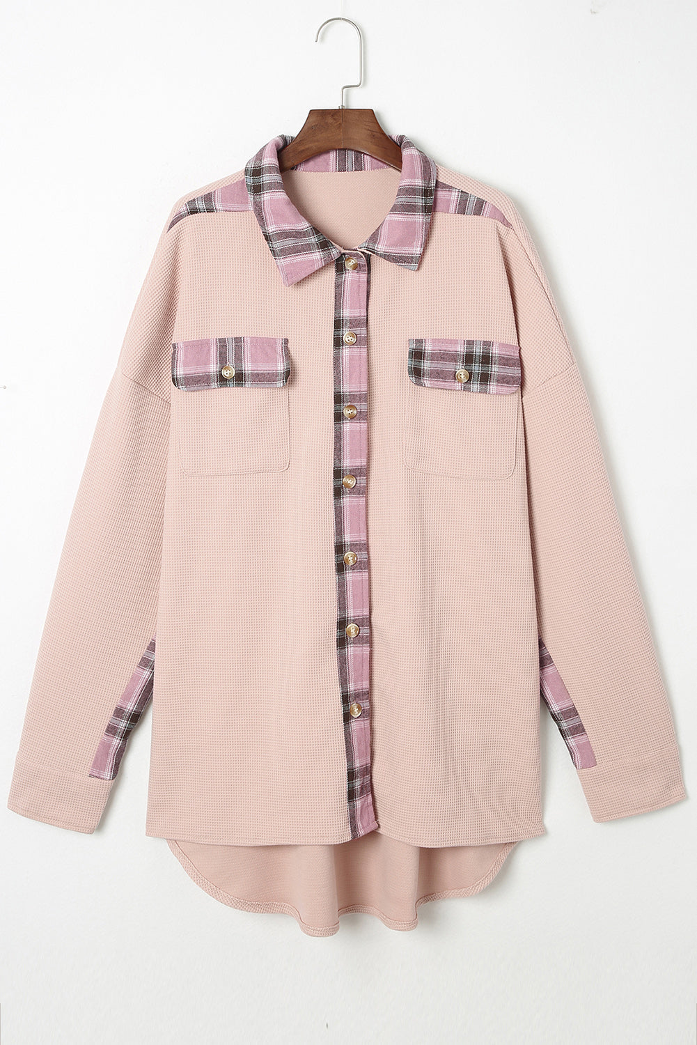 Pink waffle knit overshirt with plaid trim on collar, pockets, and cuffs.