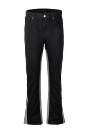 Black bootcut jeans with contrast grey side panels and raw hem