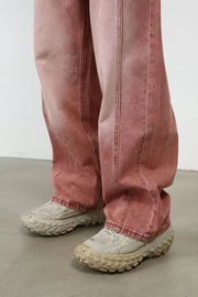 Relaxed fit coral denim jeans with visible stitching detail