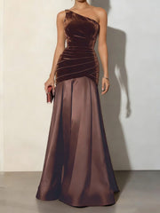 Brown velvet ruched one-shoulder maxi dress with satin skirt.