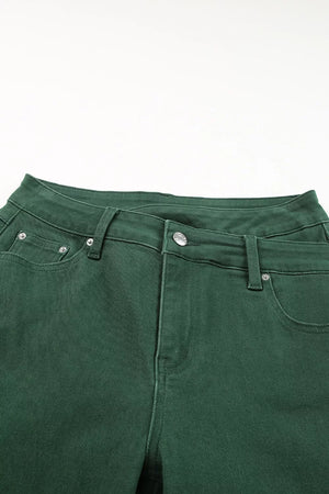 Green cotton jeans with crossed v-waist and straight leg cut.