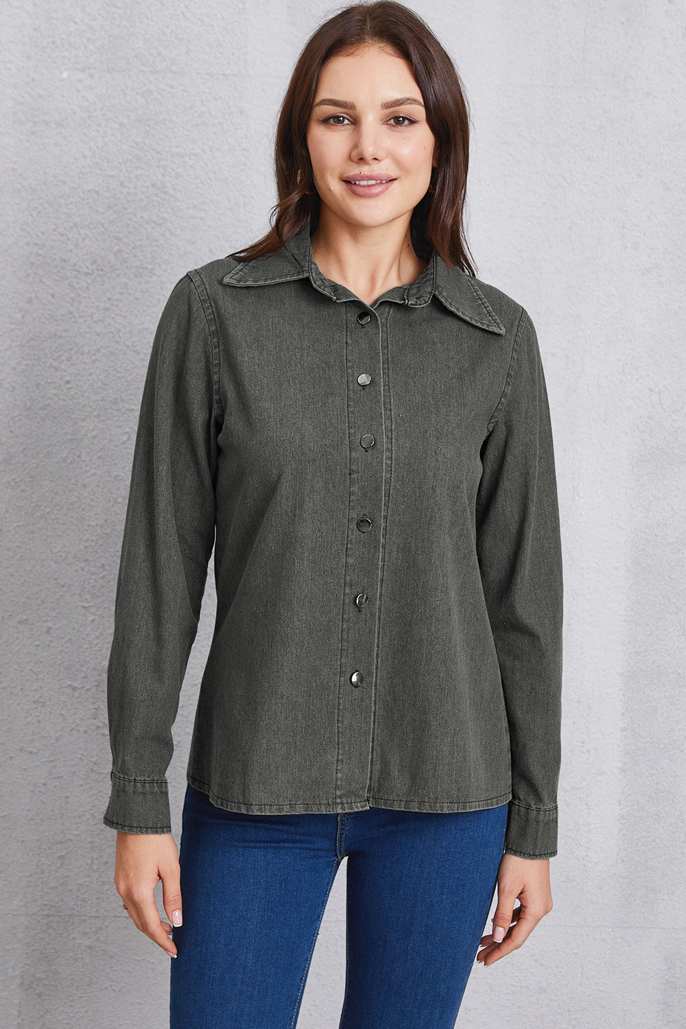 Washed denim shirt in dark gray with pointed collar and button front.