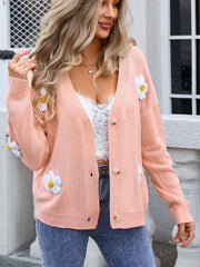 Daisy appliqué V-neck cardigan in watermelon pink acrylic with button front and long sleeves.