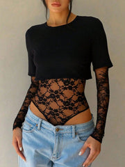 Black lace bodysuit with sheer floral sleeves and patchwork torso detail.