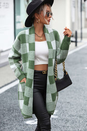Oversized checkerboard knit duster coat in matcha green with open front and pockets.