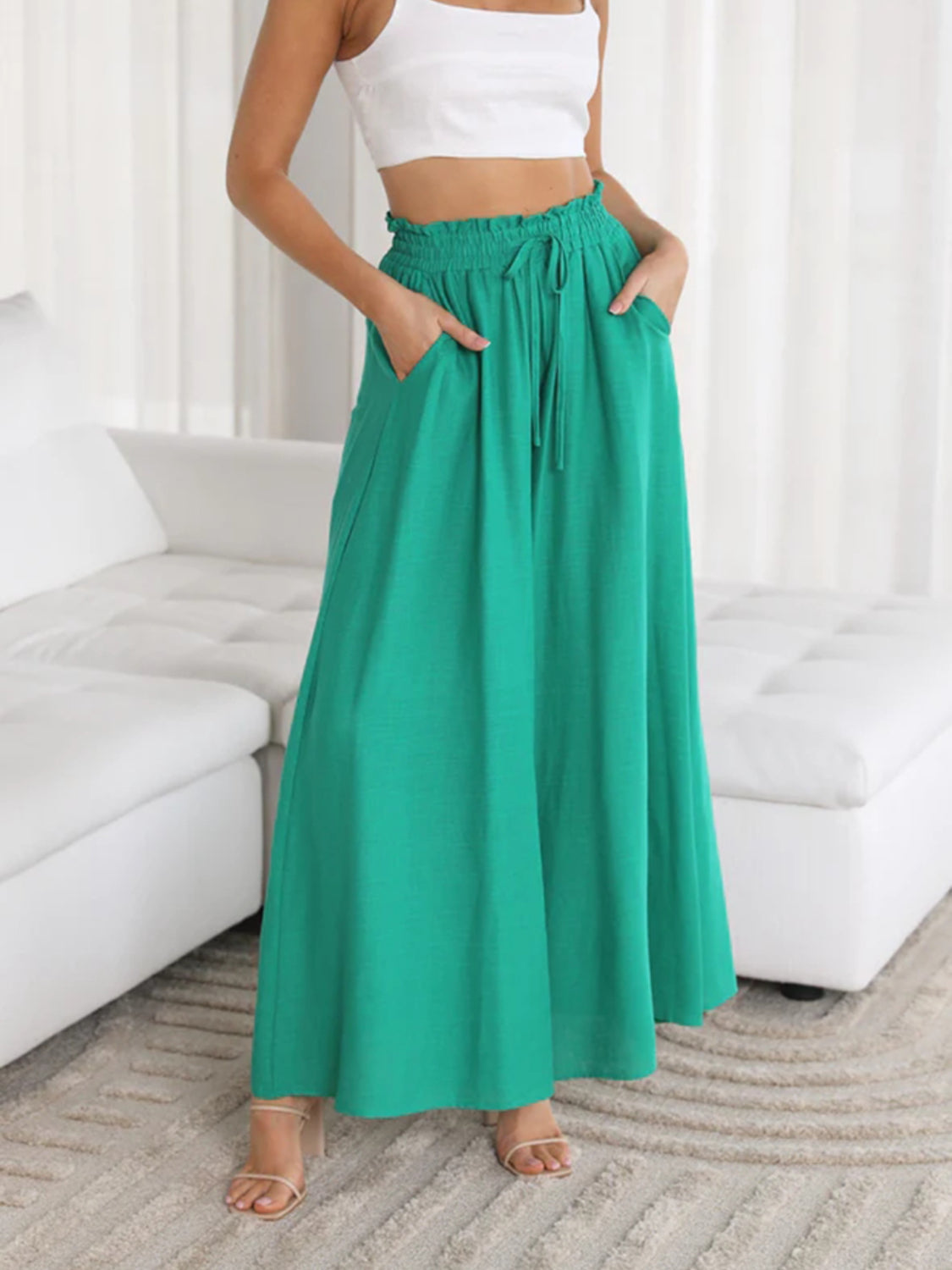 Textured drawstring palazzo trousers in turquoise with side pockets and a wide leg.
