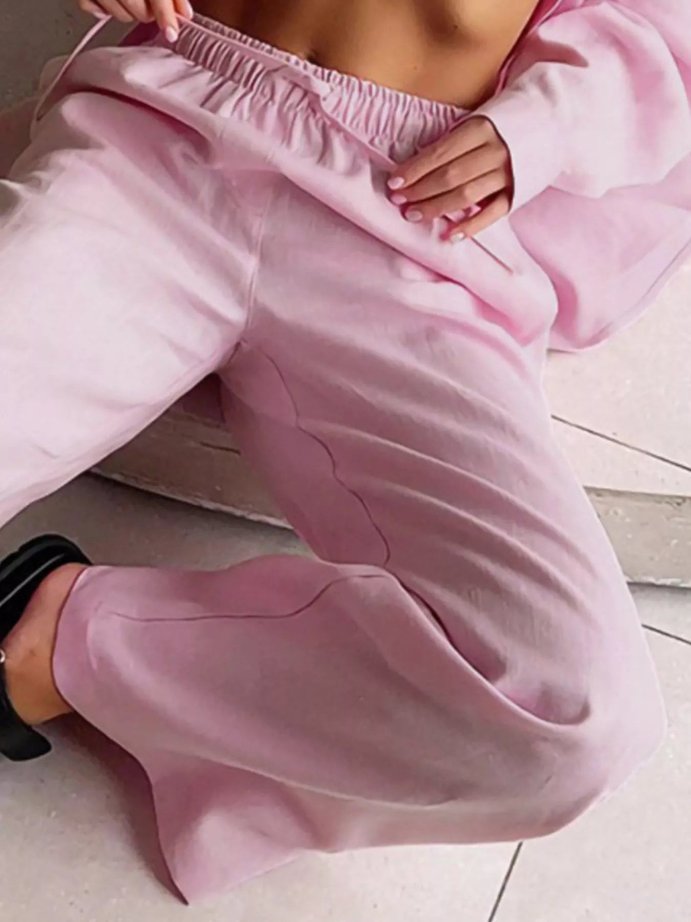 Pink relaxed fit two-piece set outfit with elastic waistband pants and button-up shirt detail.