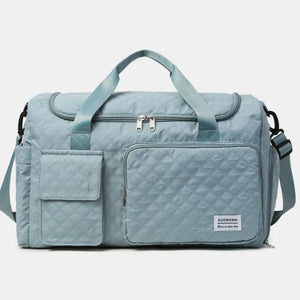 Air Force Blue quilted duffel bag with olive accents and multiple pockets.