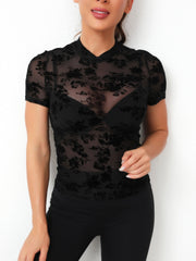Black velvet floral mesh mock neck top with short sleeves.