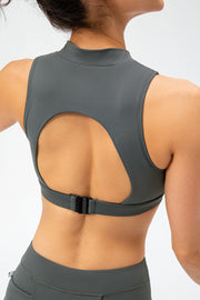 High-neck active crop top in grey with cutout back and buckle closure