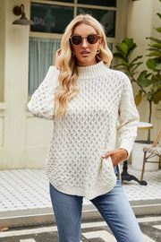 Textured diamond knit mock neck pullover sweater in white with long sleeves and a relaxed fit.