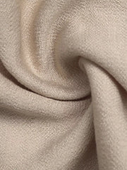 Elegant tied maxi dress in beige with textured fabric and piping detail.
