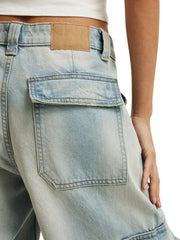 Light blue denim cargo pants with buttoned flap pocket and leather patch detail.