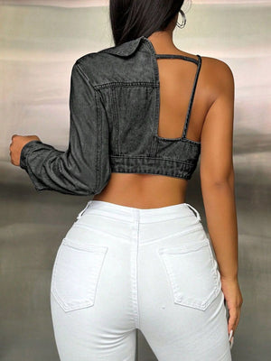 Dark gray denim asymmetric crop trucker jacket with cutout back and single long sleeve.