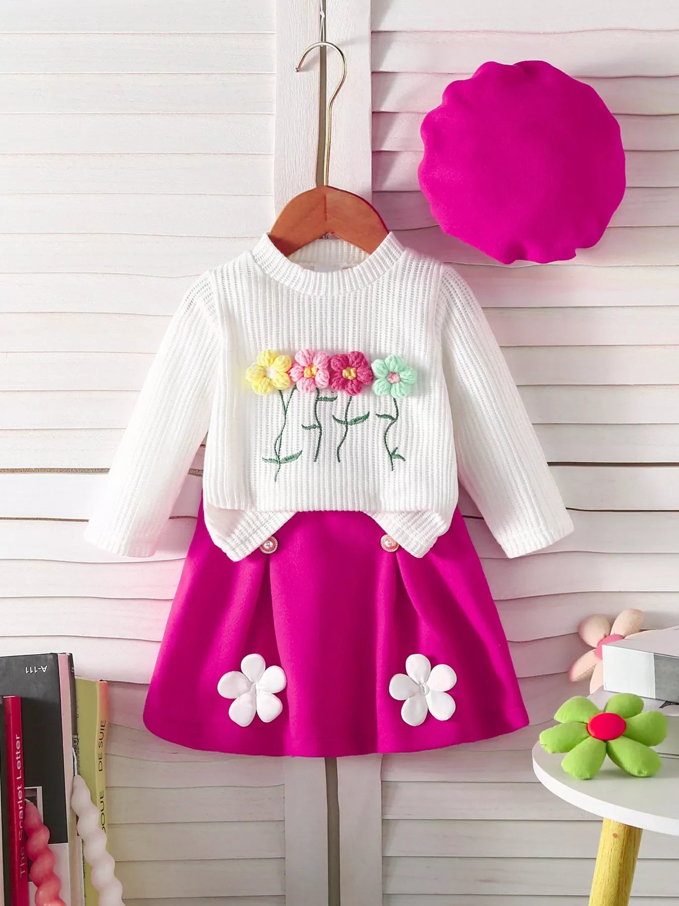 White knit top with floral applique and hot pink skirt set for baby girls.