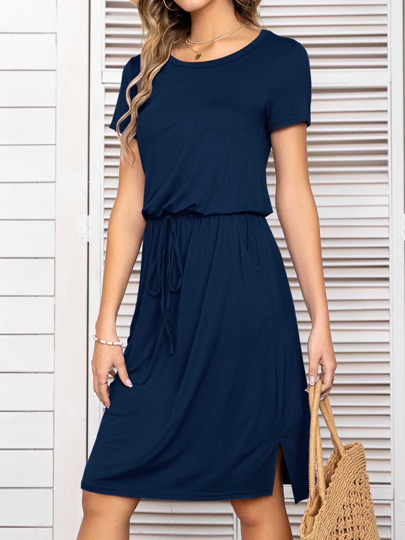 Navy midi dress with drawstring waist, short sleeves, round neck, and side slits.
