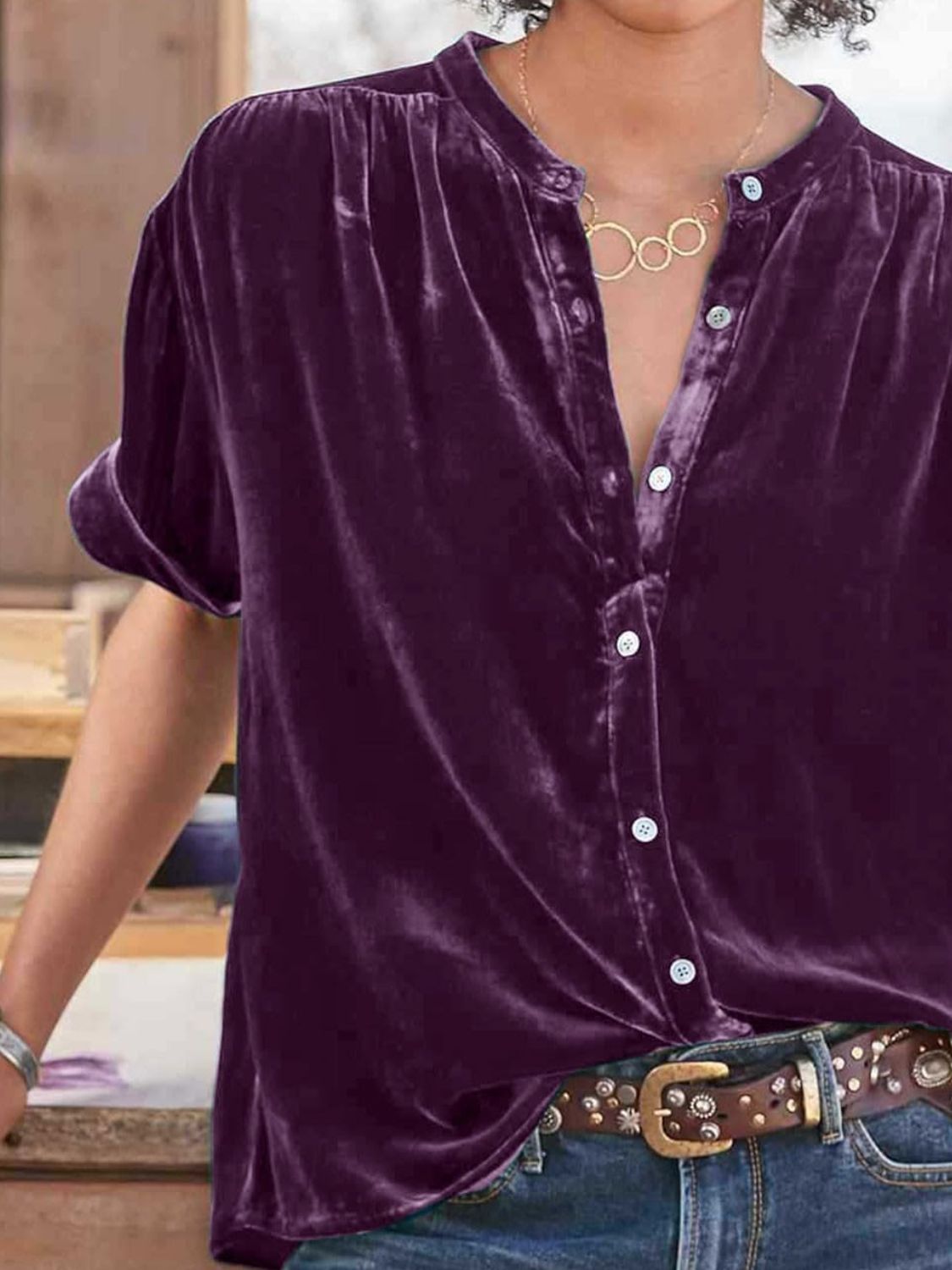 Velvet button-down top in plum purple with mandarin collar and short sleeves.