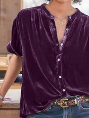 Velvet button-down top in plum purple with mandarin collar and short sleeves.