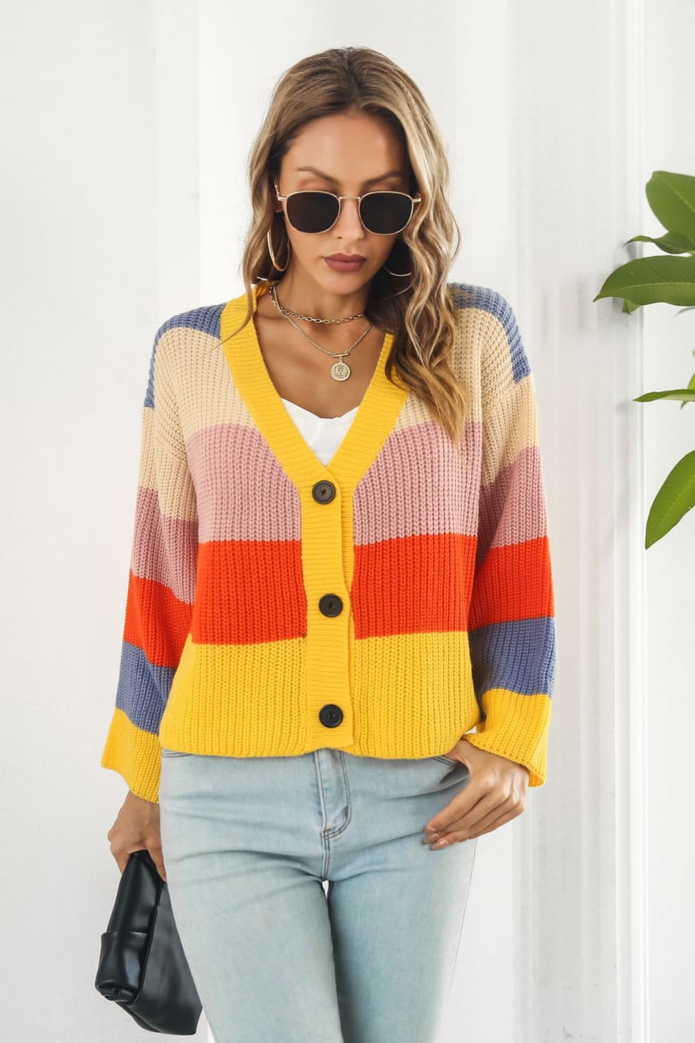 Rainbow block button-down knit cardigan in acrylic with V-neck and long sleeves.