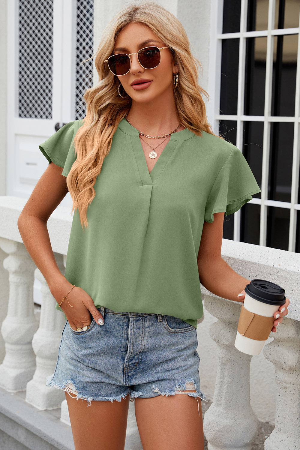 Light Green Flutter Sleeve V-Neck Blouse with a relaxed fit.